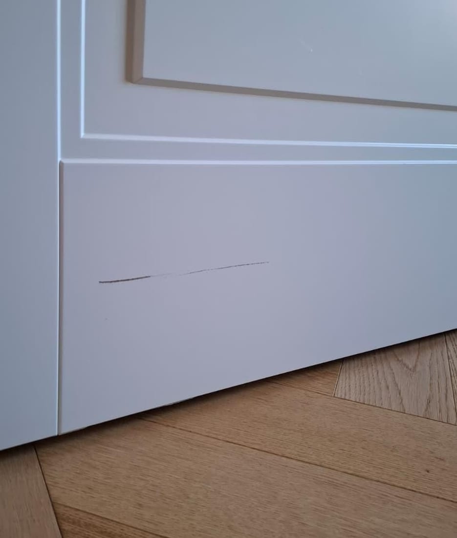 Impact damage on a door leaf Before